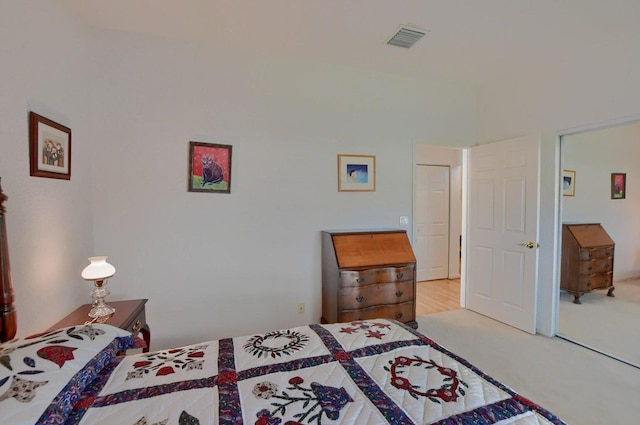 carpeted bedroom with a closet