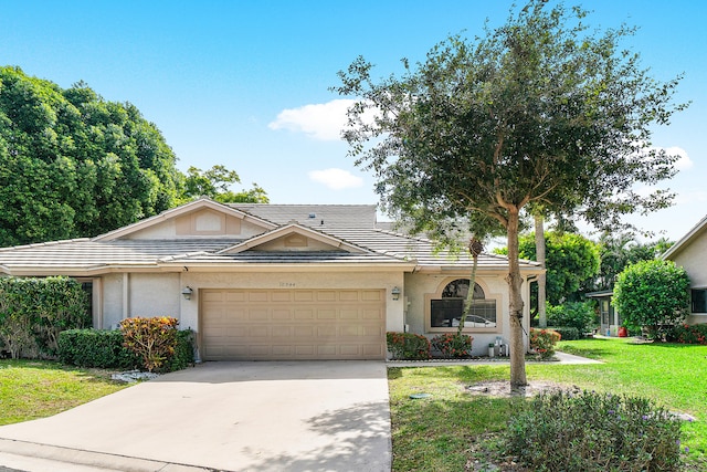 ranch-style house with a front lawn and a garage