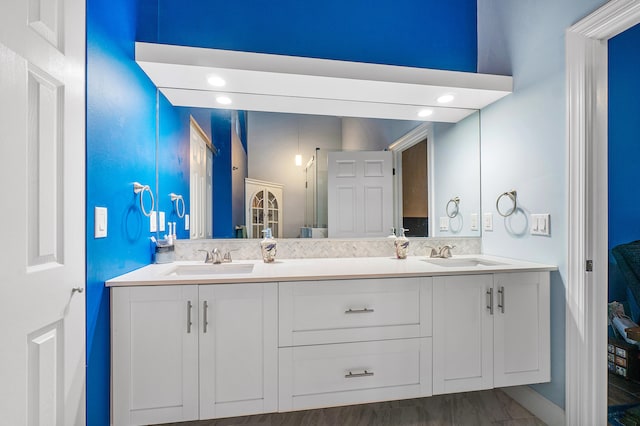 bathroom featuring vanity and hardwood / wood-style floors