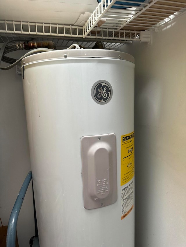 utility room with water heater