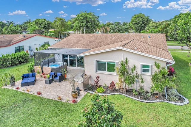 rear view of property with a patio, an outdoor living space, roof with shingles, stucco siding, and a hot tub