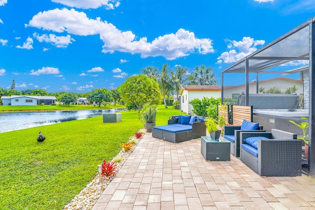 view of patio featuring a water view, a hot tub, a lanai, and an outdoor living space