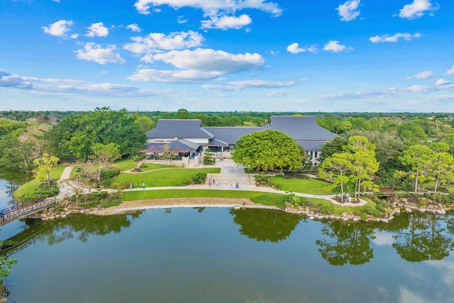 birds eye view of property with a water view