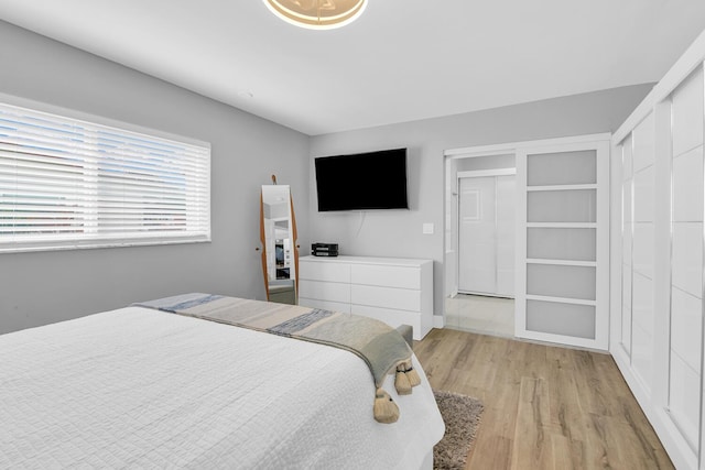 bedroom featuring light wood finished floors