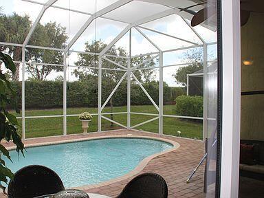 view of pool with a lanai and a patio area