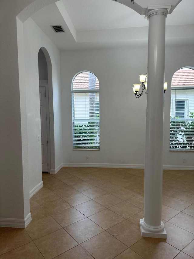 tiled spare room with ornate columns