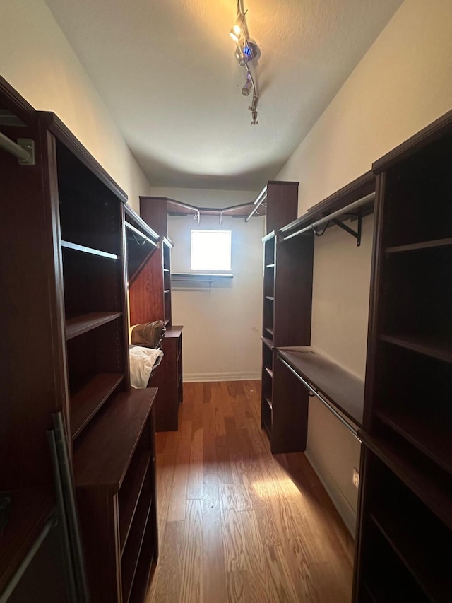 walk in closet featuring hardwood / wood-style floors