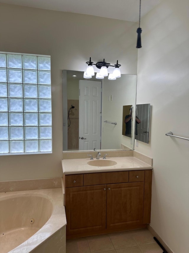 bathroom with tile patterned floors, vanity, and independent shower and bath