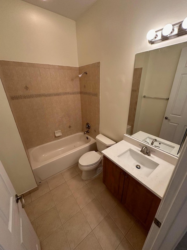 full bathroom featuring tile patterned floors, vanity, toilet, and tiled shower / bath