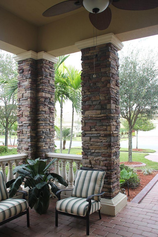 view of patio featuring ceiling fan