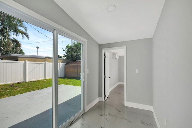 doorway to outside featuring lofted ceiling