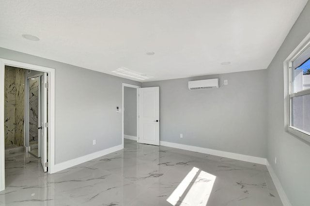 spare room featuring a wall unit AC