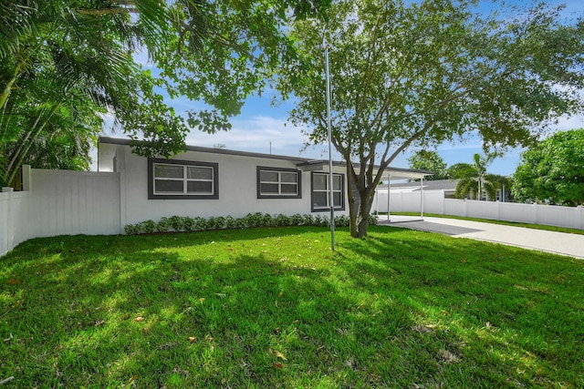 ranch-style house with a patio and a front yard