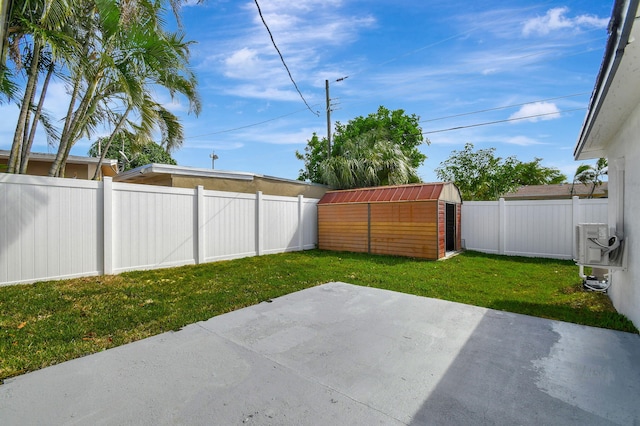 view of yard with a shed and a patio area