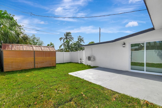 view of yard with a patio area and a storage unit