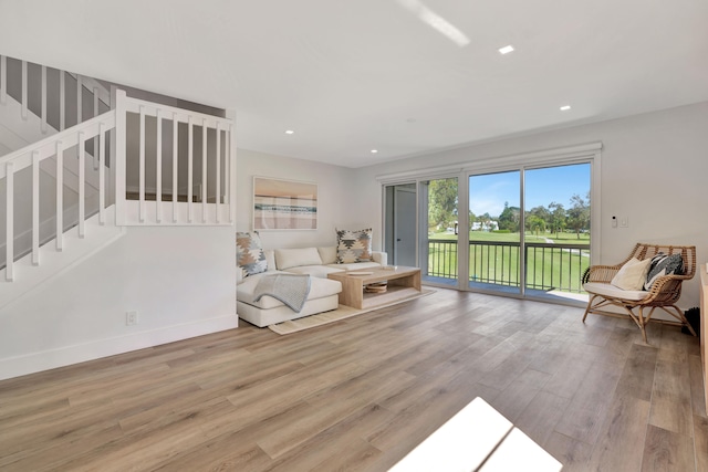 living room with light hardwood / wood-style flooring