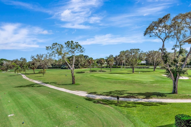 view of property's community with a lawn