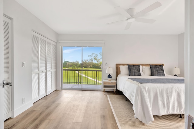 bedroom featuring ceiling fan, light hardwood / wood-style floors, and access to outside