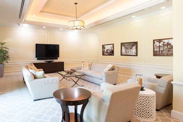 carpeted living room with a raised ceiling and crown molding