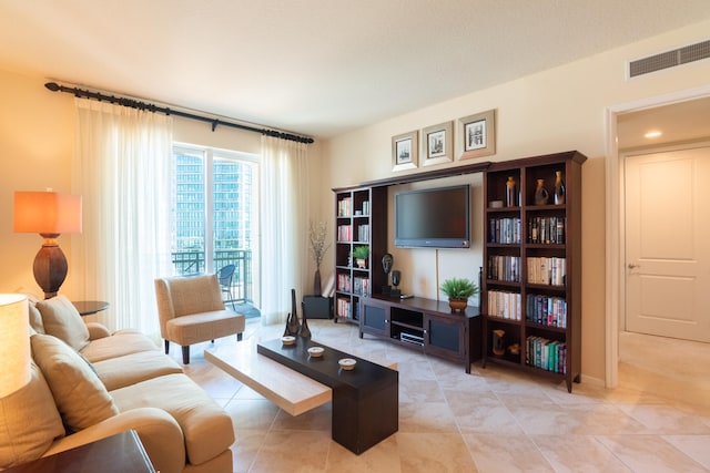 living room featuring light tile patterned floors