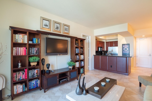 living room with light tile patterned floors