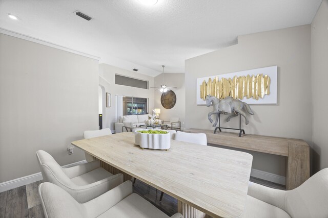 5481 Royal Palm Beach Blvd, West Palm Beach, FL 33411 - dining area with wood finished floors, baseboards, ceiling fan, and lofted ceiling