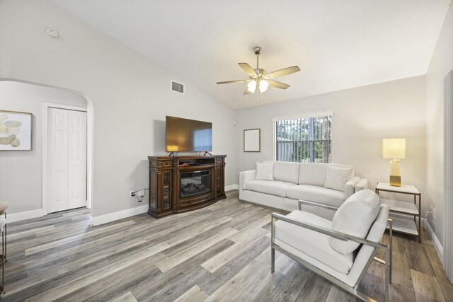 5481 Royal Palm Beach Blvd, West Palm Beach, FL 33411 - living room with ceiling fan, baseboards, wood finished floors, lofted ceiling, and arched walkways