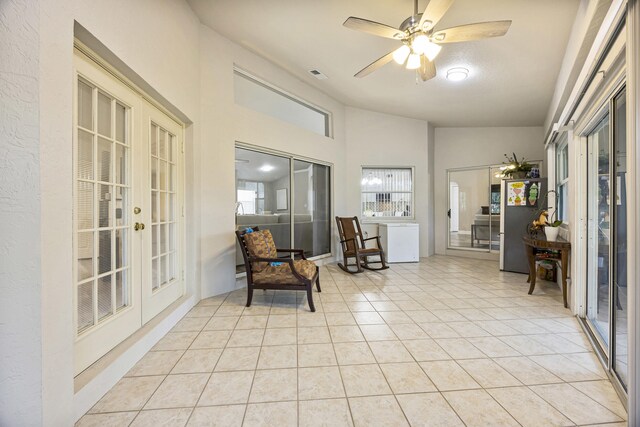 5481 Royal Palm Beach Blvd, West Palm Beach, FL 33411 - sitting room with french doors, light tile patterned floors, ceiling fan, lofted ceiling, and healthy amount of natural light