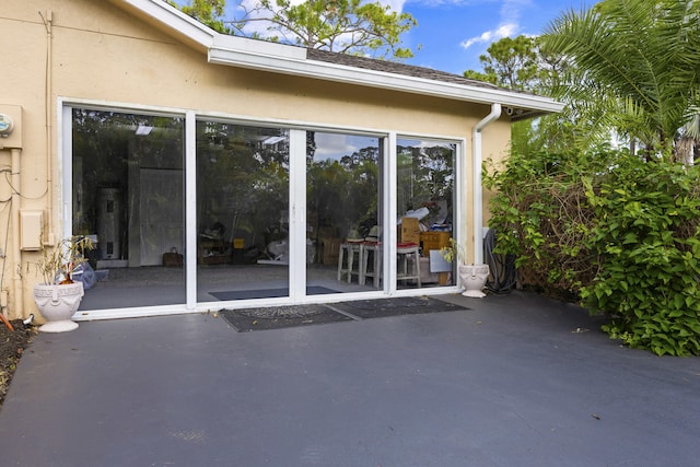 entrance to property featuring a patio area