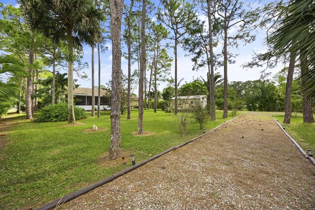 5481 Royal Palm Beach Blvd, West Palm Beach, FL 33411 - view of property's community with a yard
