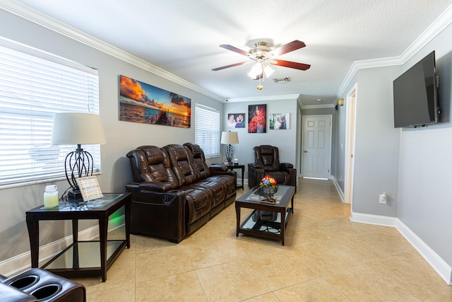 living room with ornamental molding, ceiling fan, light tile patterned floors, and plenty of natural light