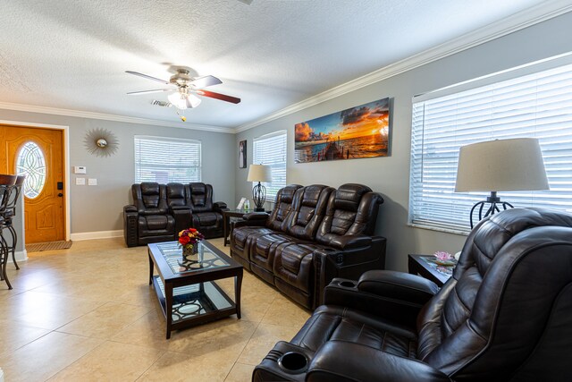 tiled living room featuring ornamental molding, a textured ceiling, and ceiling fan