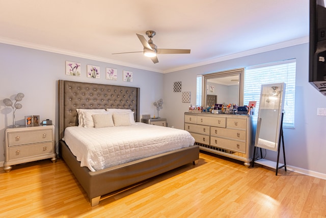 bedroom featuring light hardwood / wood-style flooring, ornamental molding, and ceiling fan