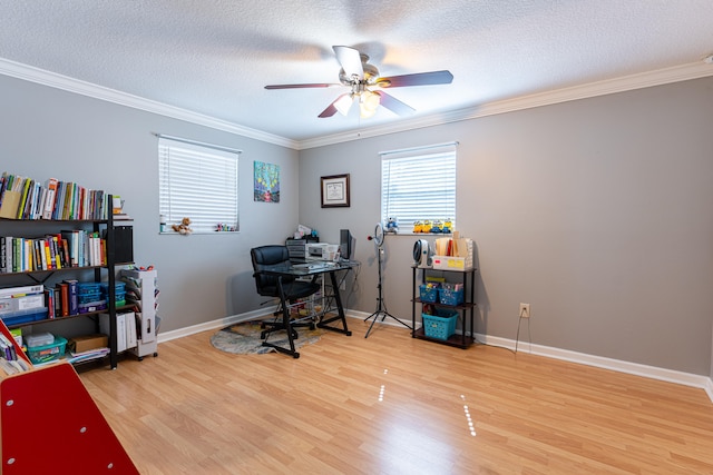 home office featuring crown molding, a textured ceiling, light wood-type flooring, and ceiling fan