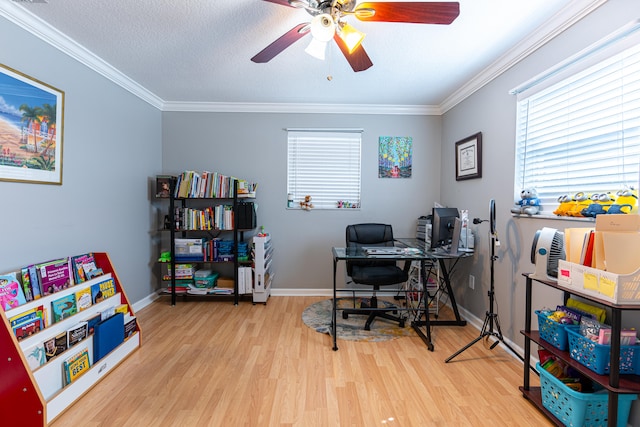 office featuring ornamental molding, light wood-type flooring, and ceiling fan