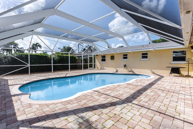 view of pool featuring a patio and a lanai