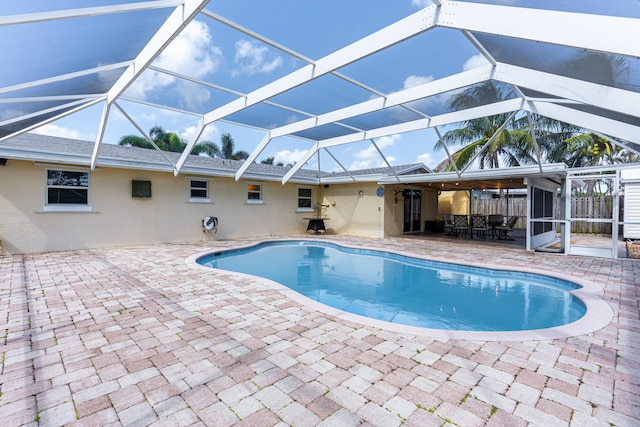 view of pool featuring a patio area and a lanai