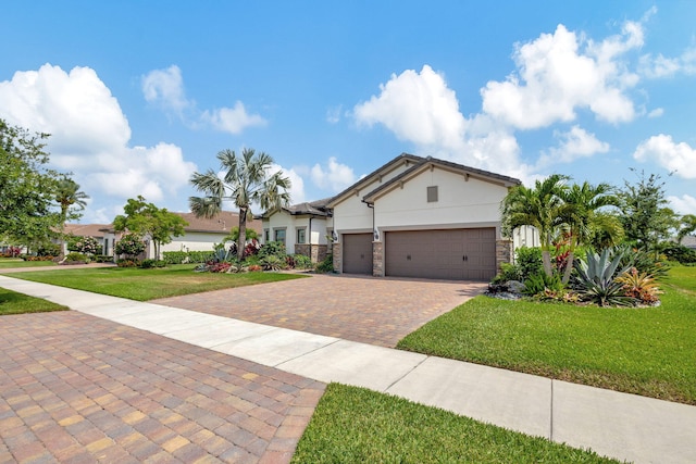 ranch-style home with a front lawn and a garage