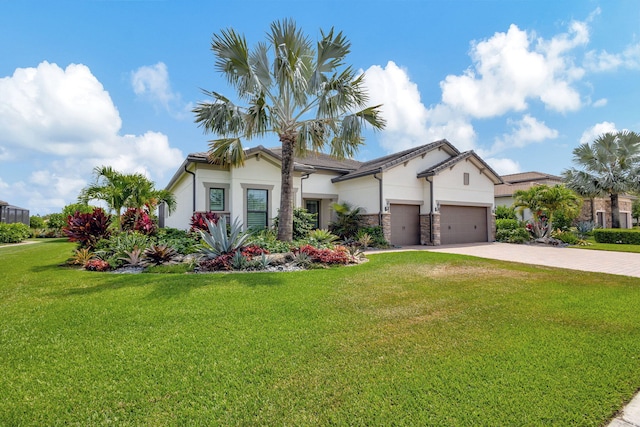 view of front of house featuring a front lawn and a garage