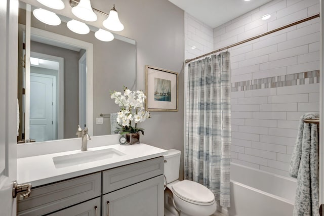 full bathroom with vanity, shower / bath combo, and toilet