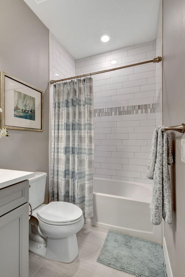 full bathroom with vanity, toilet, tile patterned floors, and shower / bath combo with shower curtain