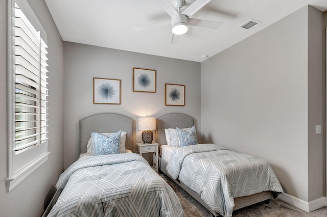 carpeted bedroom featuring ceiling fan