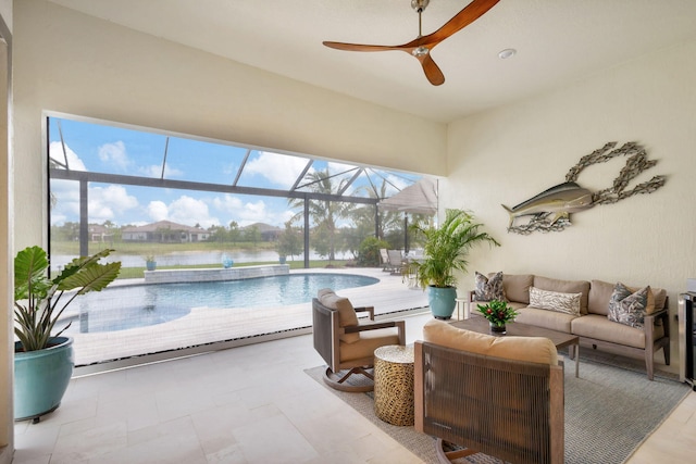 view of swimming pool with glass enclosure, a patio, ceiling fan, outdoor lounge area, and a water view