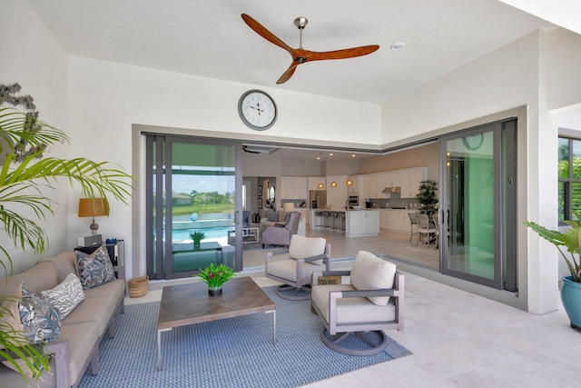 living room featuring ceiling fan