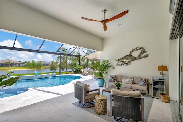 view of swimming pool featuring an outdoor living space, a lanai, a patio area, a water view, and ceiling fan