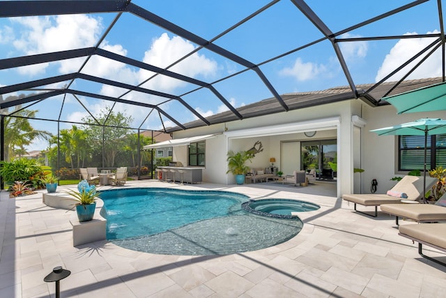 view of pool featuring an in ground hot tub, a patio area, and glass enclosure