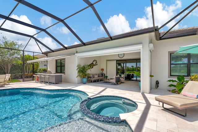 view of pool with an in ground hot tub, a patio area, and glass enclosure