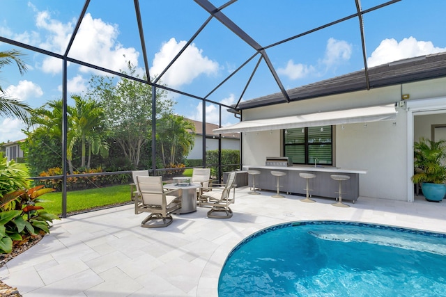 view of pool featuring a patio and glass enclosure