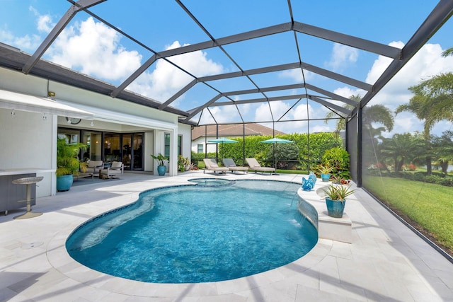 view of pool with an in ground hot tub, a patio, and glass enclosure