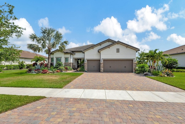 view of front of house featuring a front yard and a garage